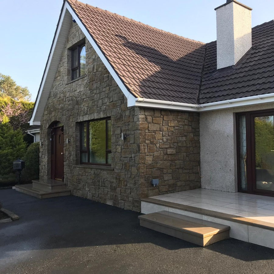Stone façade featuring Grit Sandstone Machined and sandstone steps.