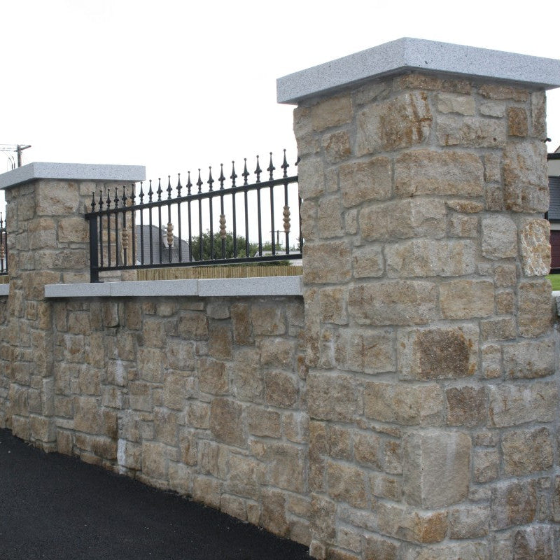 Stone boundary wall and pillars in Grit Sandstone Machined.