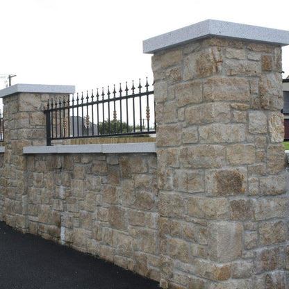 Stone boundary wall and pillars in Grit Sandstone Machined.