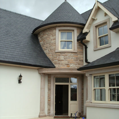 Stately house with a prominent entrance. Stonework is Grit Sandstone Machined. 