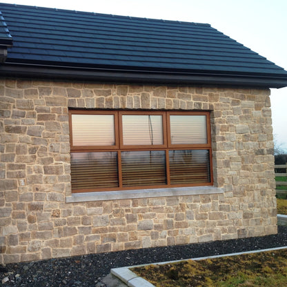 Stone feature wall finished in Grit Sandstone Stoneer Cladding.