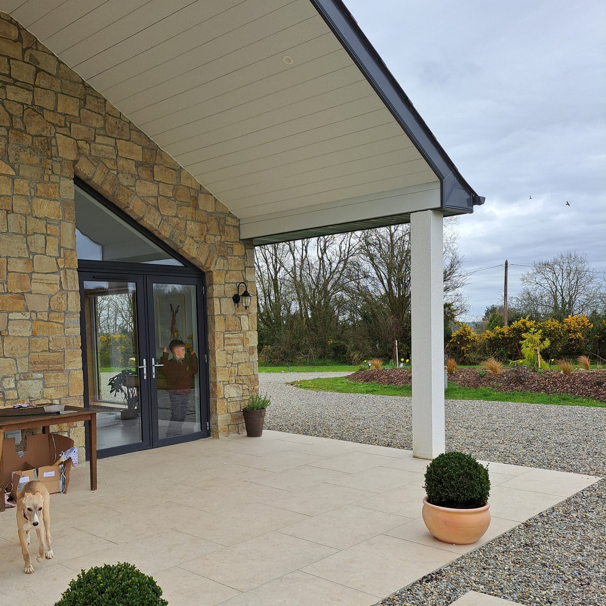 New build house with stone façade completed in Grit Sandstone Stoneer Cladding.