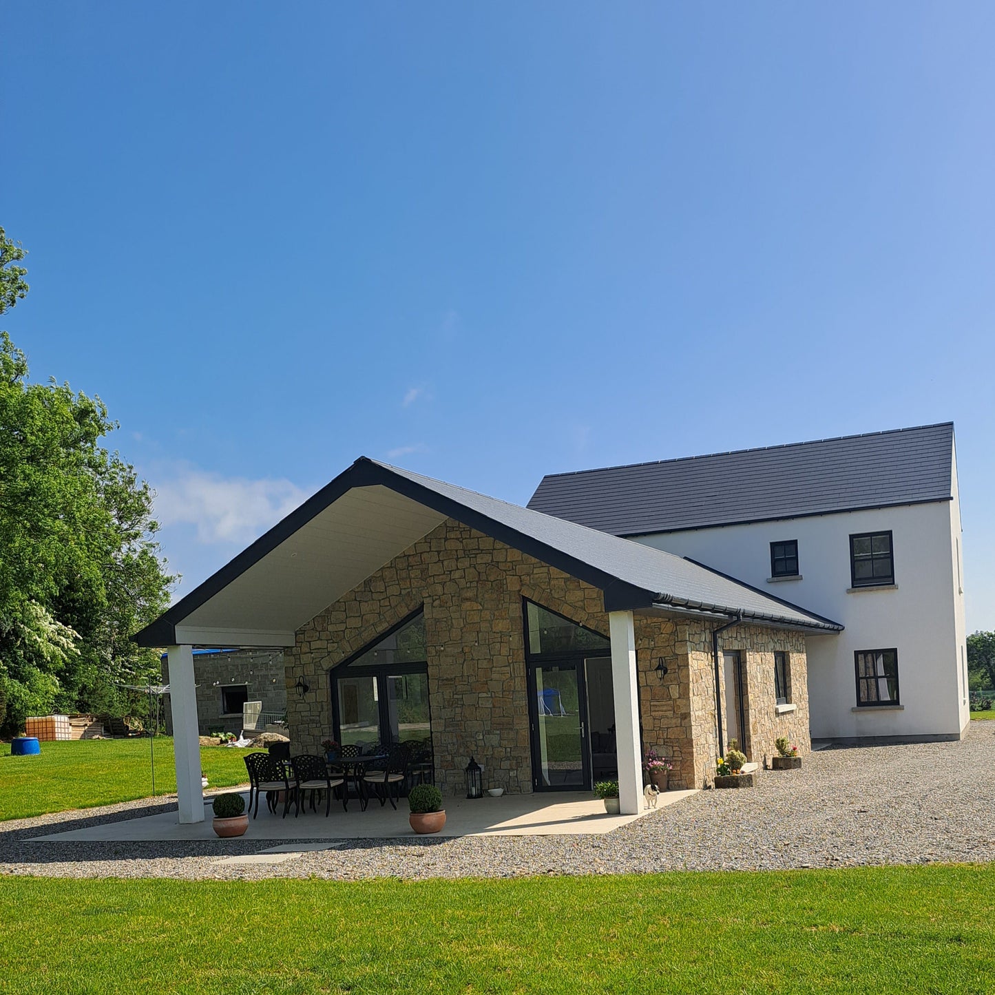 New build house with stone façade completed in Grit Sandstone Stoneer Cladding.