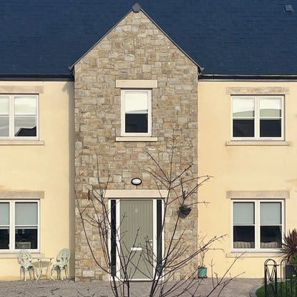 Stone feature wall finished in Grit Sandstone Stoneer Cladding.
