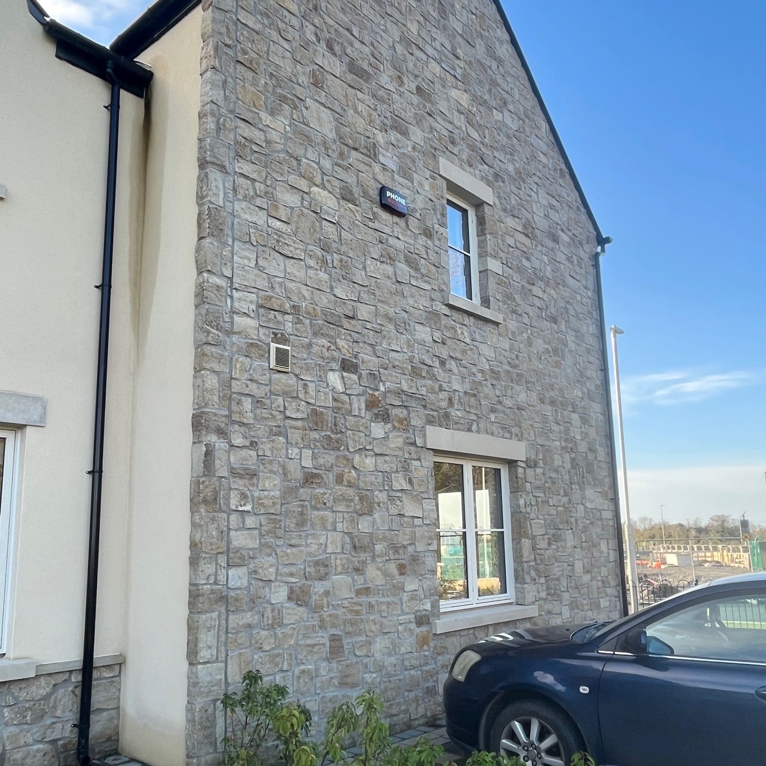 New build house with stone façade completed in Grit Sandstone Stoneer Cladding.