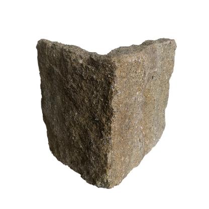 A corner piece of Grit Sandstone Stoneer Cladding. Golden brown with a gritty texture. 