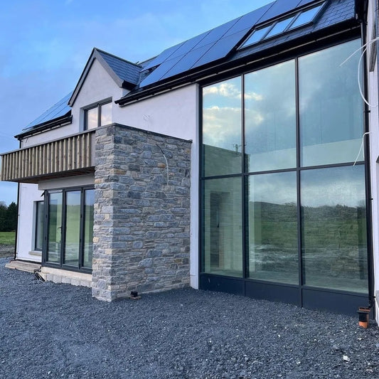 Modern new build with stone feature wall finished in Highland Blend Tumbled.