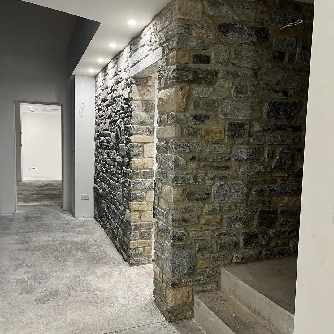 Internal stone feature wall in highland blend tumbled walling stone. 
