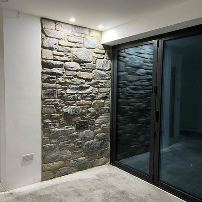 Internal stone feature wall in highland blend tumbled walling stone. 