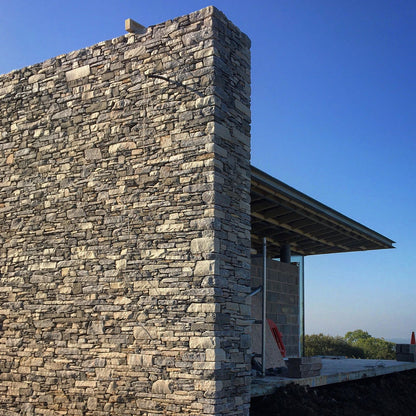 Large stone wall in Highland Blend Tumbled walling stone.