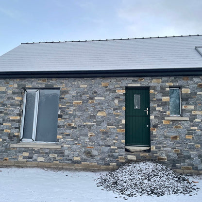 Stone house completed in highland blend tumbled walling stone. 