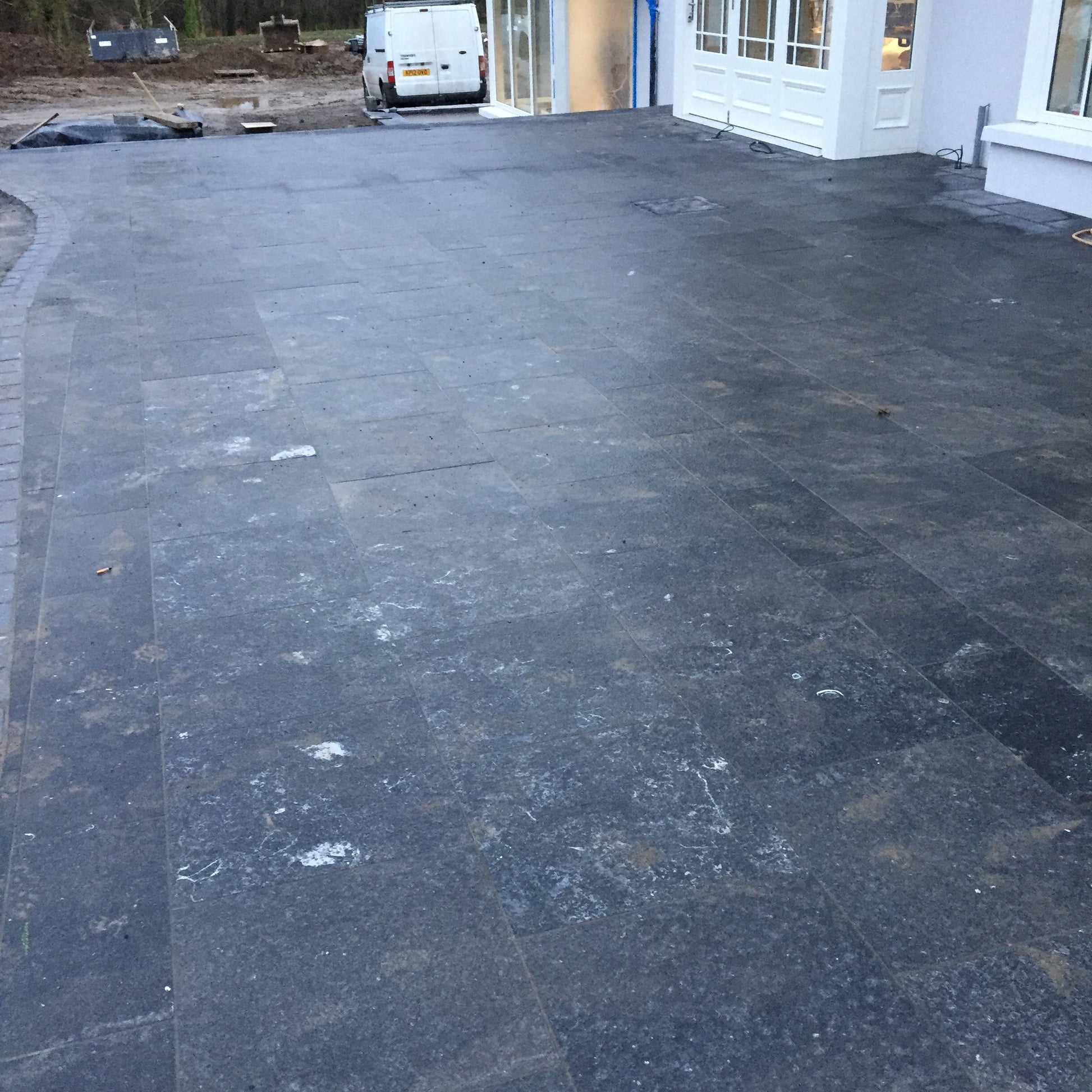 Large patio area nearing completion featuring Irish Blue Limestone Paving. 