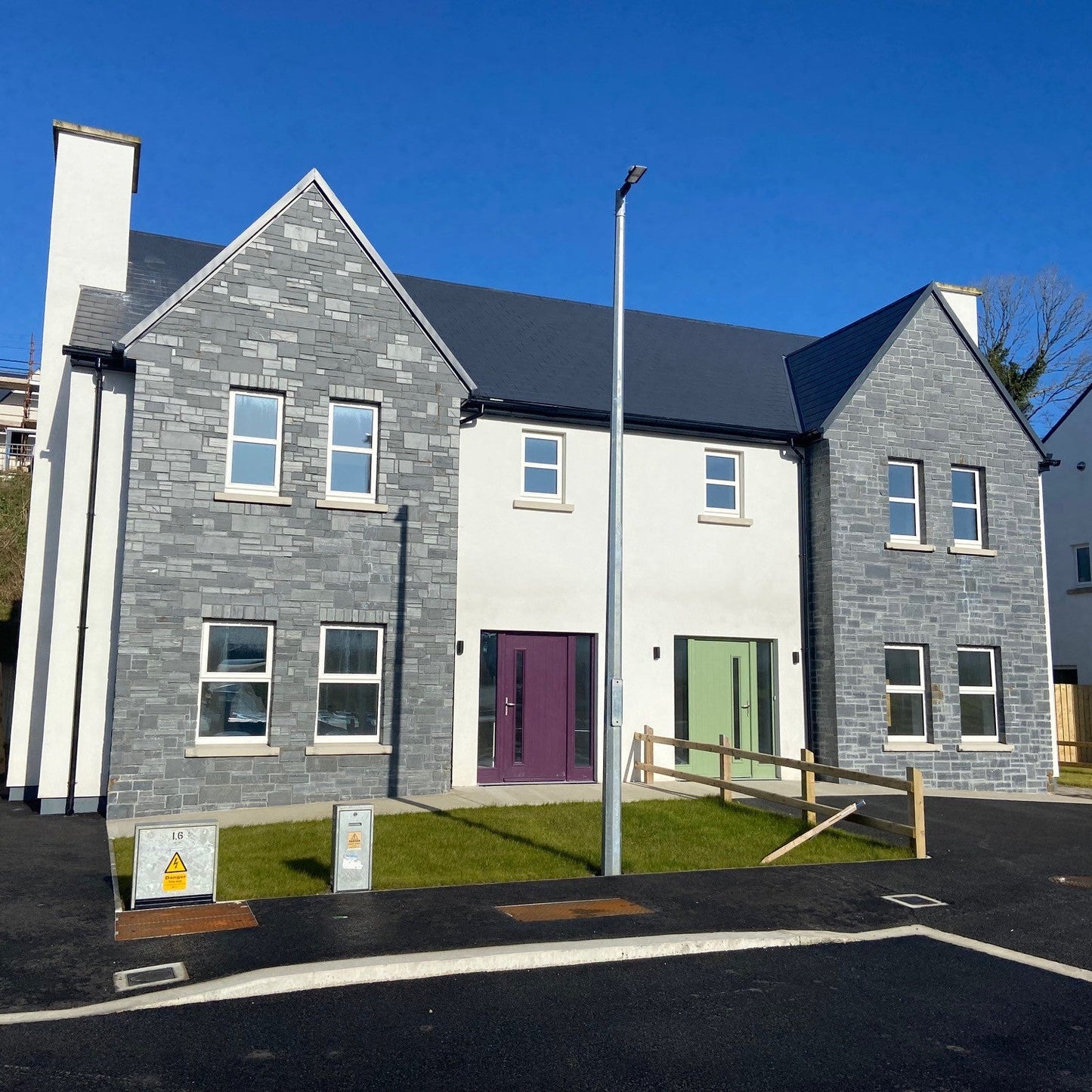 Housing estate with stone façade in Irish Slate Stoneer Cladding. 