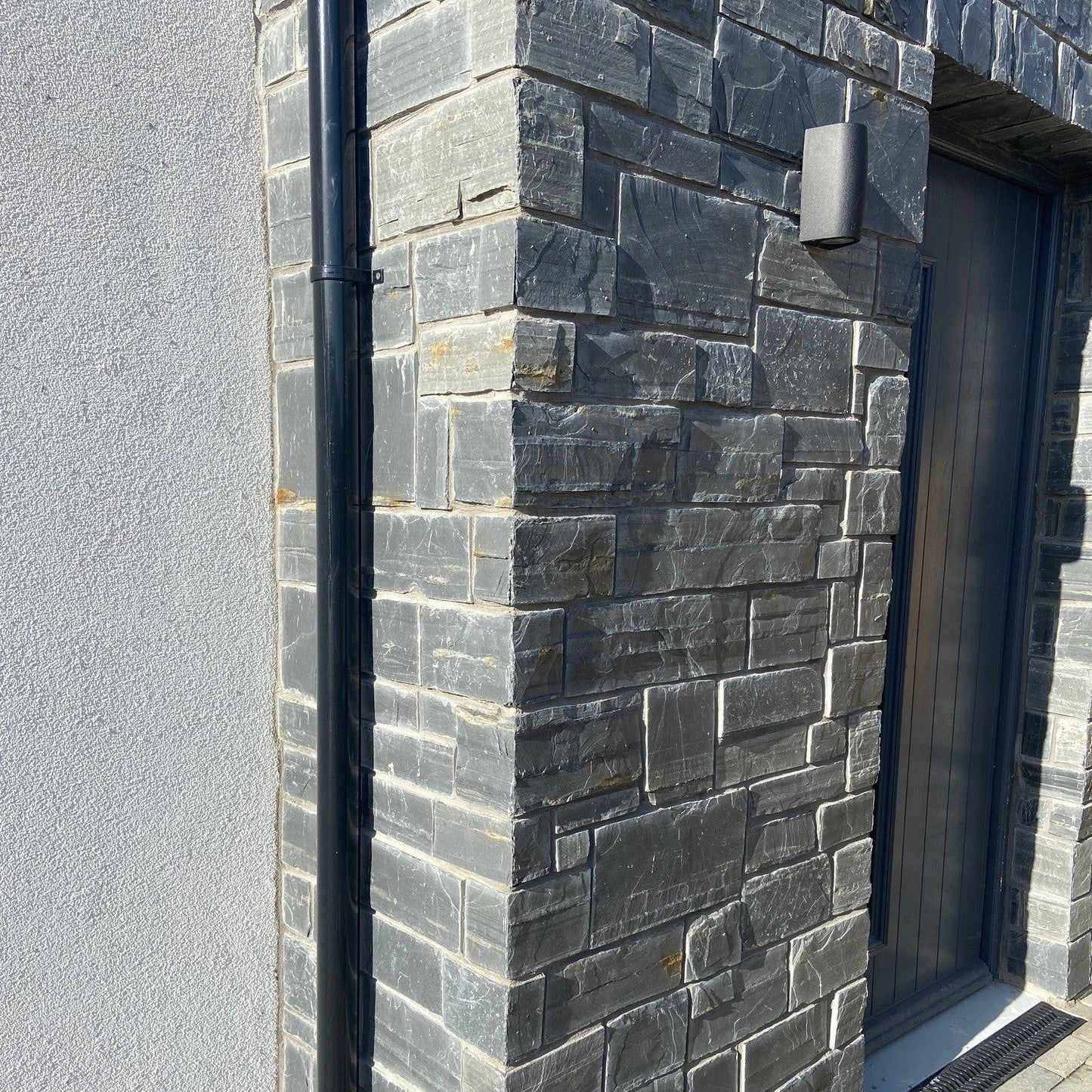 Close up of entrance stone in Irish Slate Stoneer Cladding. 