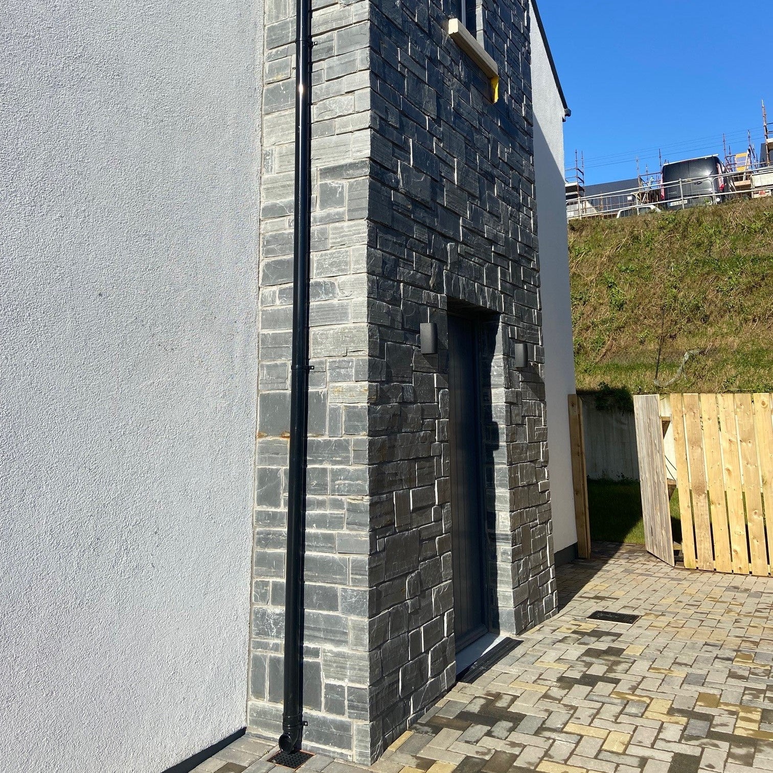 Side entrance façade in Irish Slate Stoneer Cladding. 