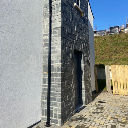 Side entrance façade in Irish Slate Stoneer Cladding. 