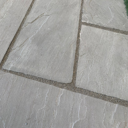 Grey Sandstone Paving grouted with JOINTEX Easy Joint in grey colour. 