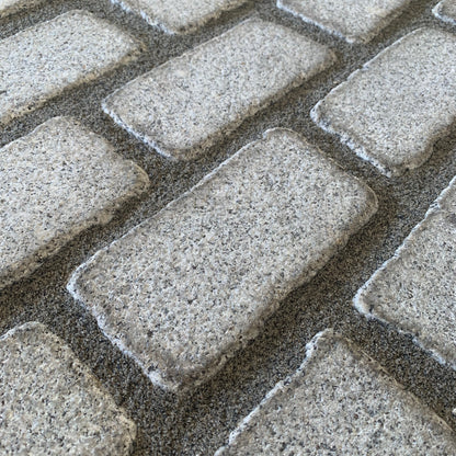 Silver Granite Cobbles grouted with JOINTEX Easy Joint in grey colour. 