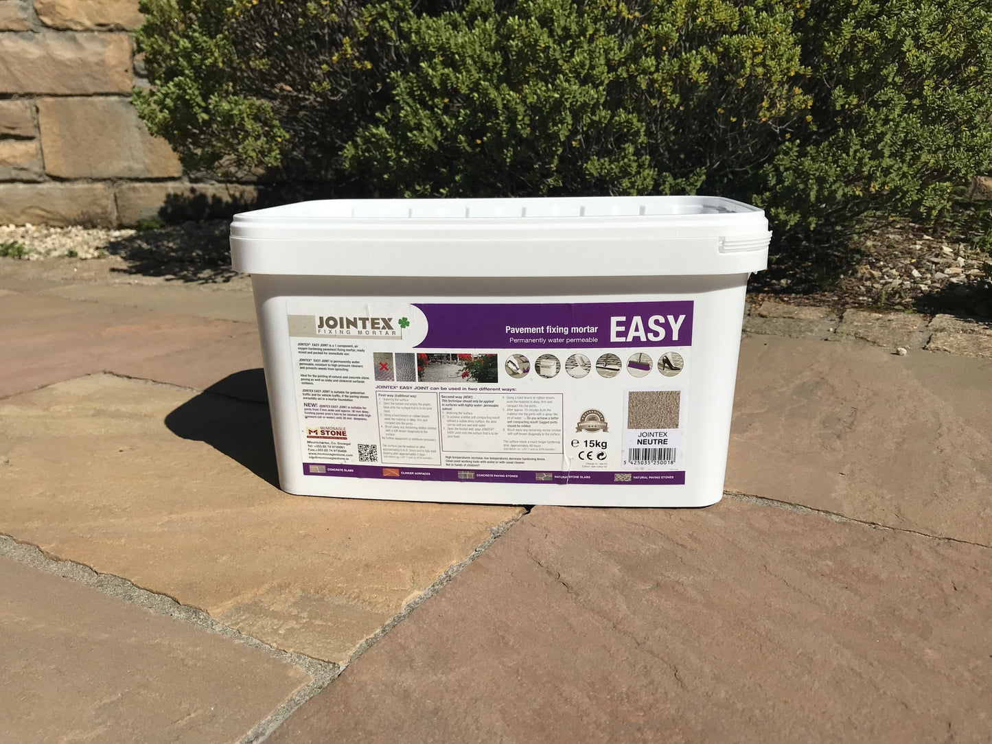 JOINTEX Easy Joint – Neutral 15kg  Tub on modak natural stone paving. 