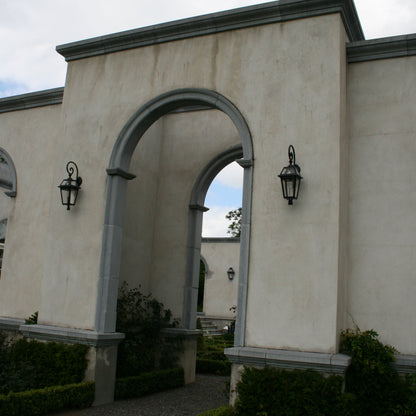 Archway with decorative bespoke blue limestone surround. 