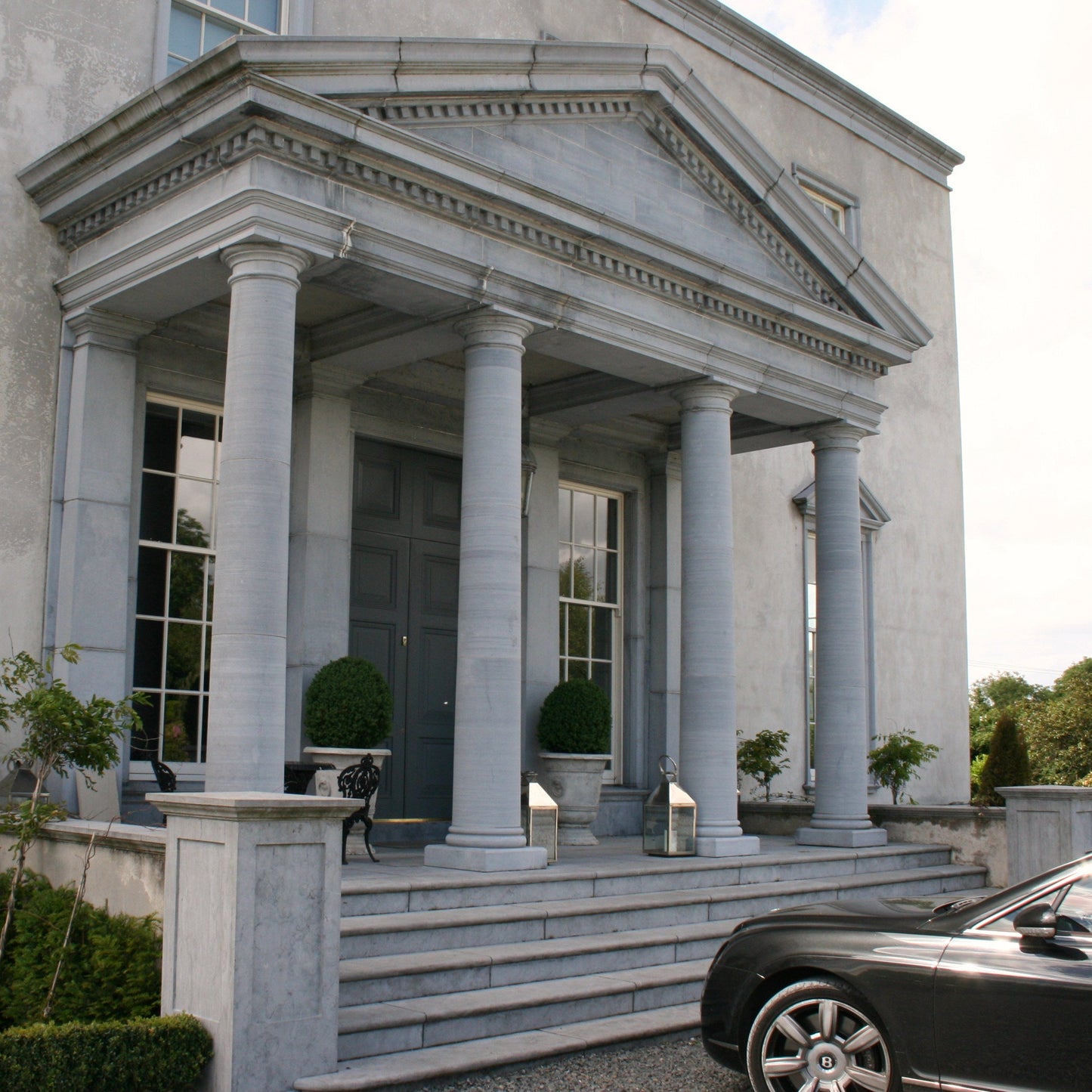 Large Limestone Portico and steps leading to an elegant stately home. 