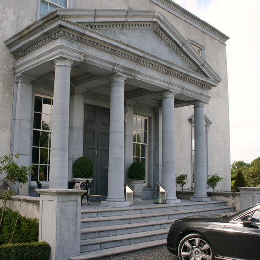 Large Limestone Portico and steps leading to an elegant stately home. 