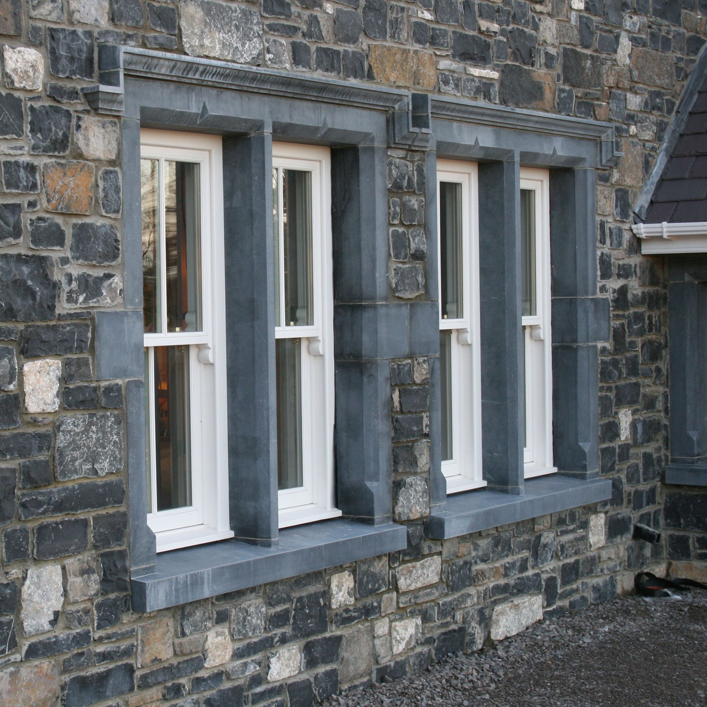 Stone building with Bespoke Limestone Window Surrounds. 