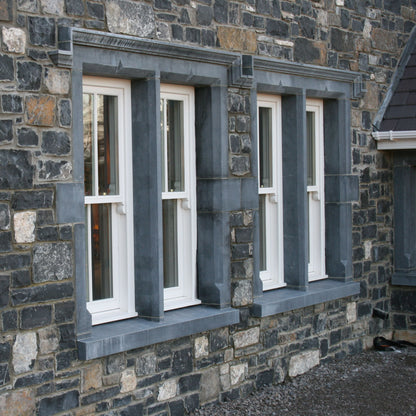 Stone building with Bespoke Limestone Window Surrounds. 
