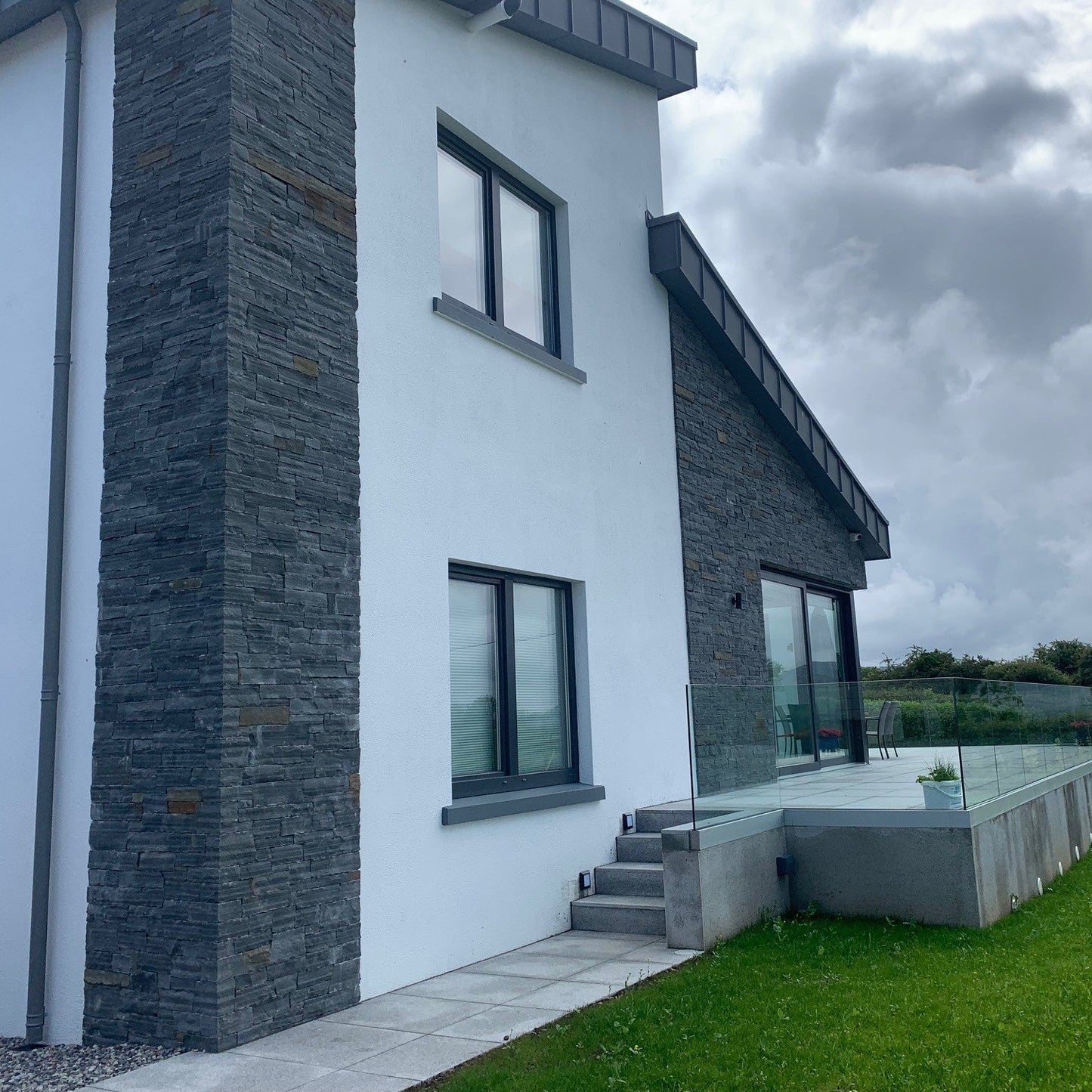 Contemporary new build featuring Liscannor Slate Stoneer Cladding on external feature walls. 
