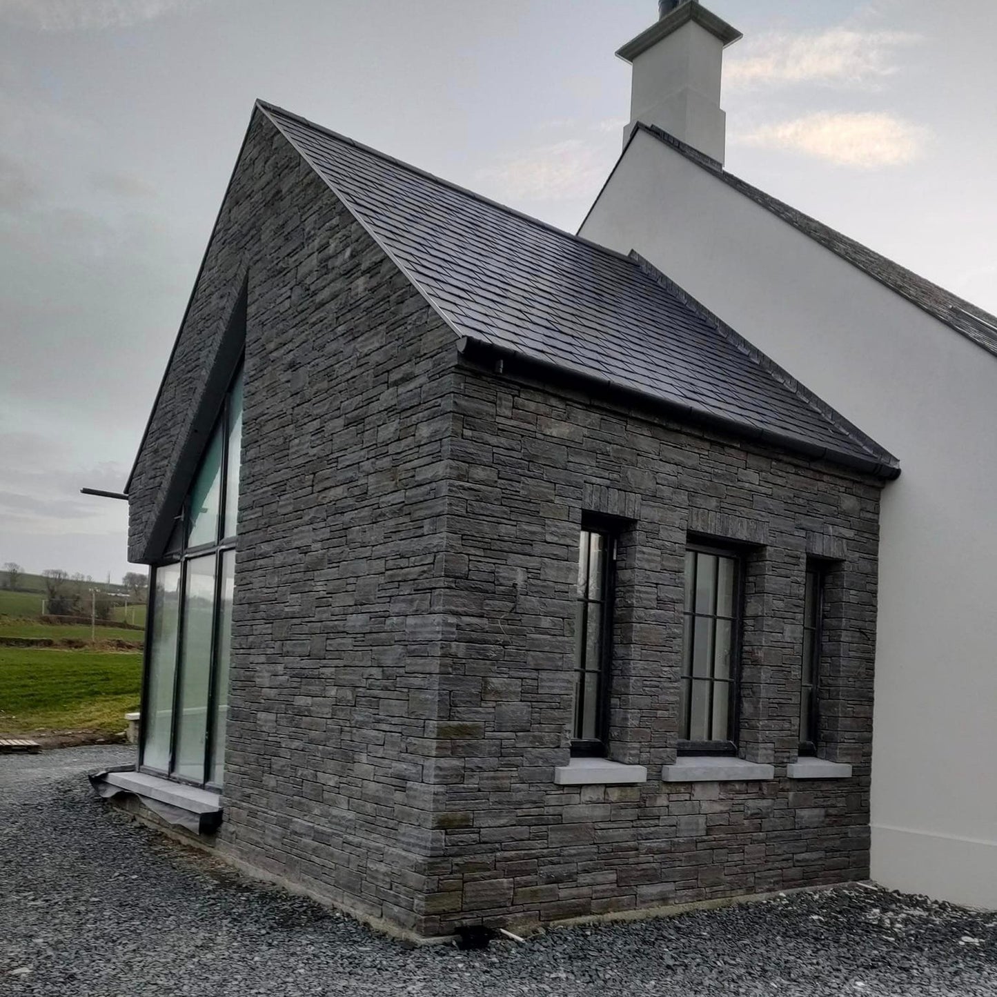 Modern new build cladded in Liscannor Slate Stoneer Cladding. 