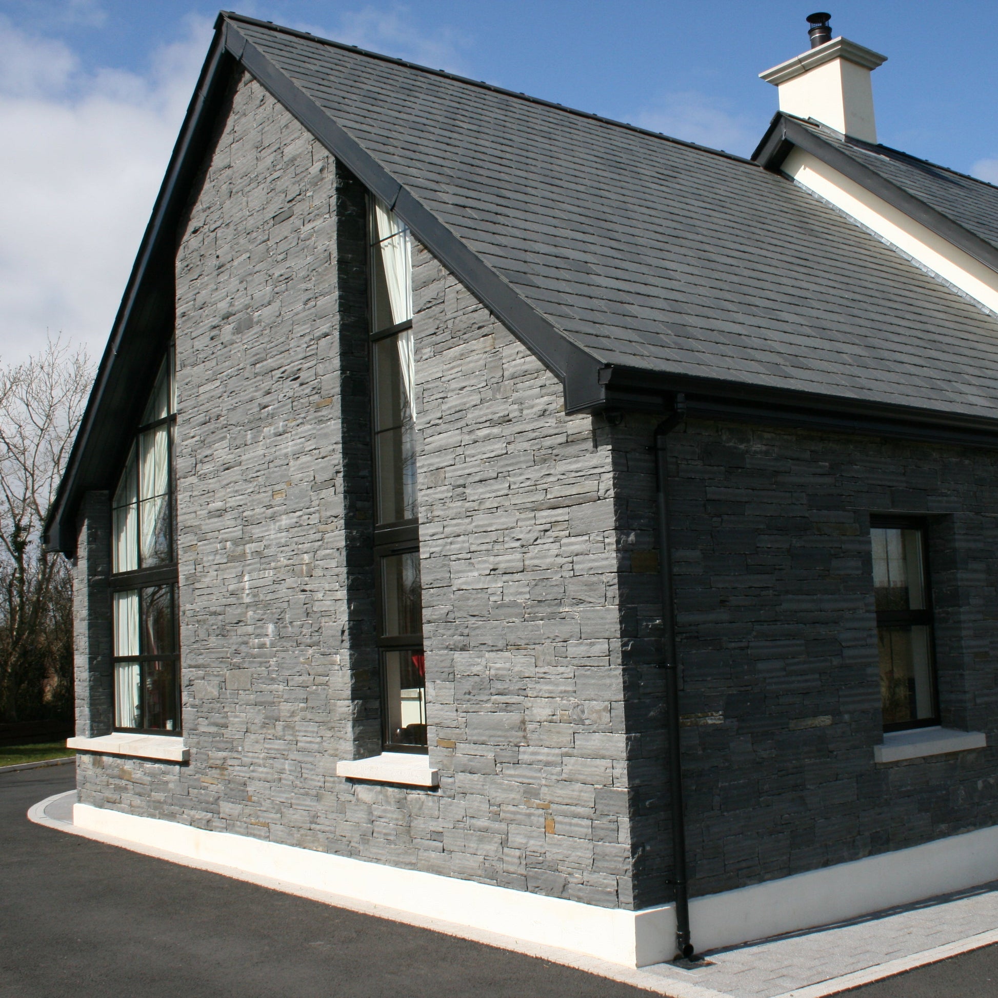 Stone façade completed in Liscannor Slate Stoneer Cladding.