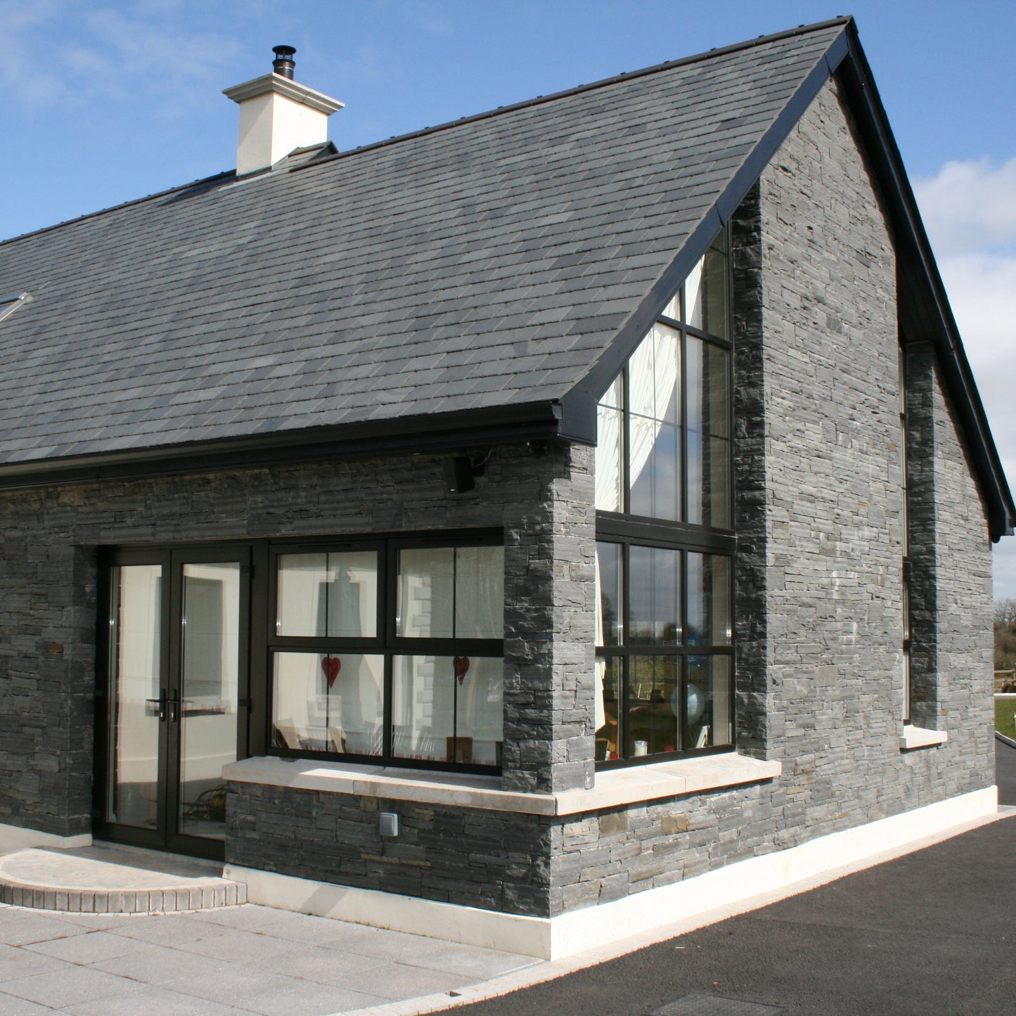 Modern stone façade completed using Liscannor Slate Stoneer Cladding.