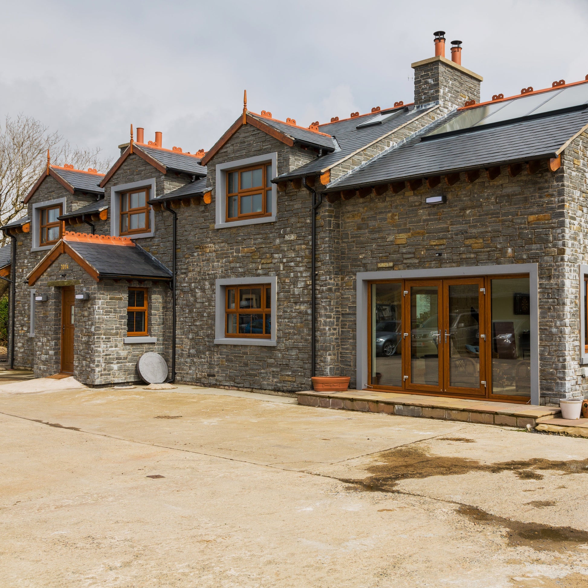 Stone house featuring Liscannor Slate Stoneer Cladding. 