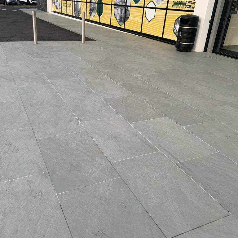 Public paving outside commercial building featuring Mercury Grey Jewel Range Porcelain Paving in 900 x 600 x 20mm size.