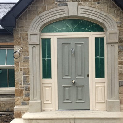 Bespoke Sandstone Door Surround and steps on a stone porch. 
