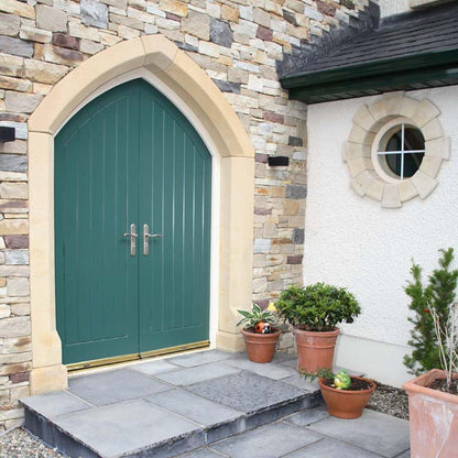 Stone entrance featuring a unique bespoke sandstone door surround. 