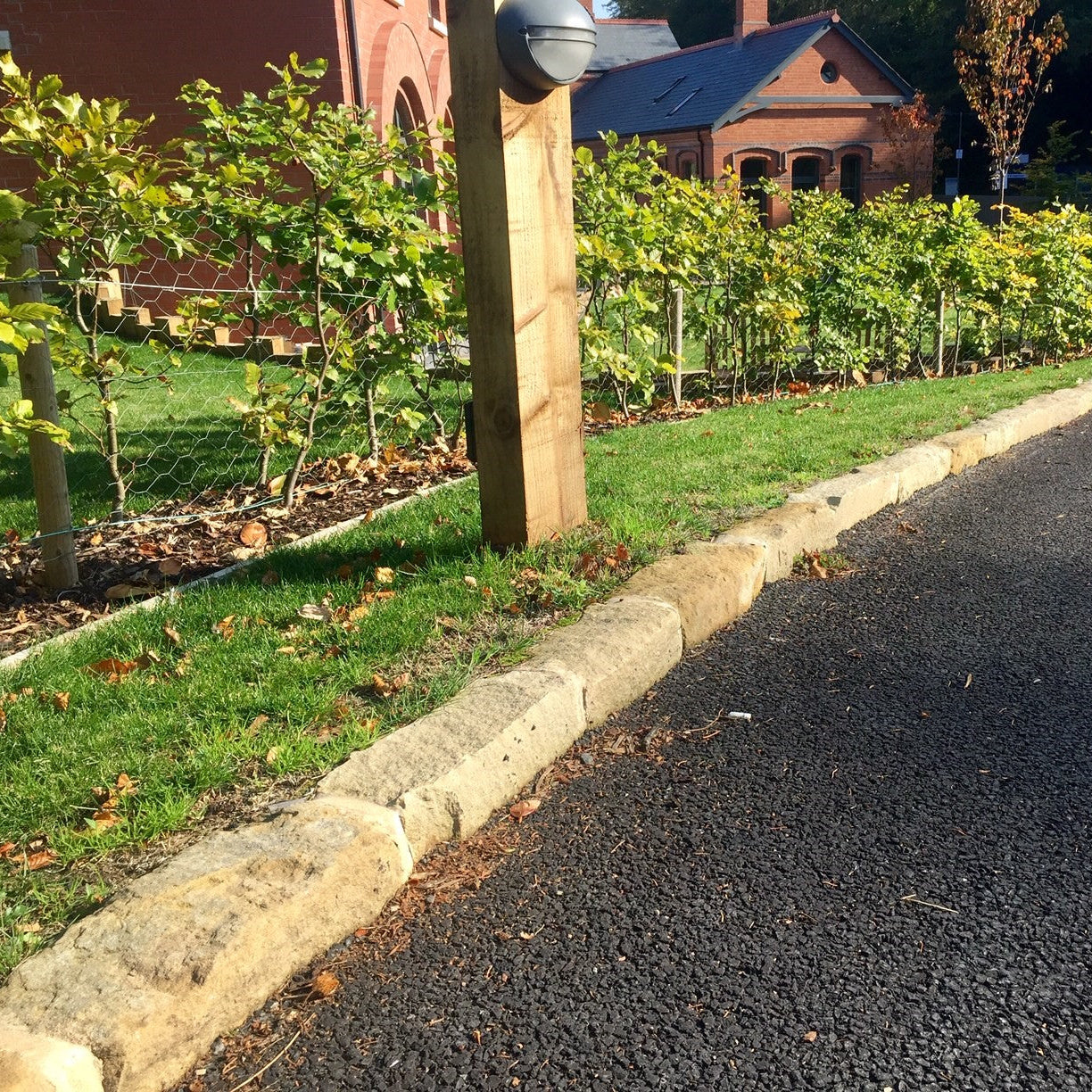 Driveway edging completed using Mountcharles Sandstone Kerbing. 