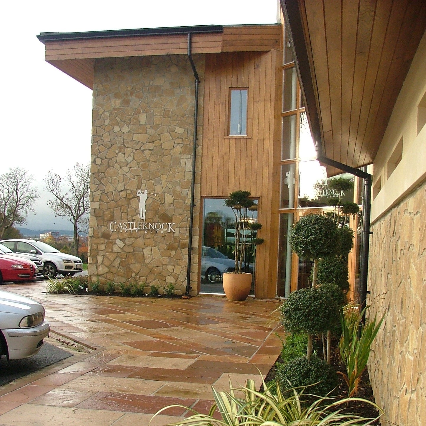 Castleknock golf club entrance featuring stone and wooden architecture. Stone is Mountcharles Sandstone Machined Rubble.