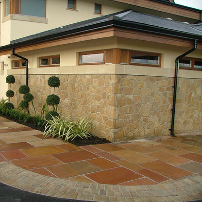 Golf club with decorative stone walling in Mountcharles Sandstone Machined Rubble. 
