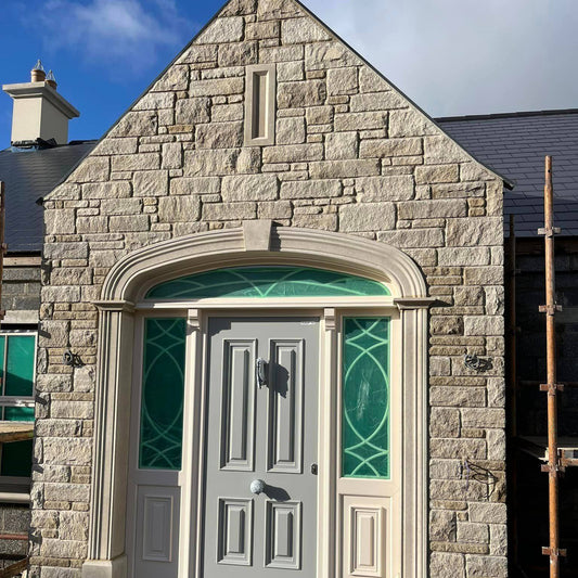 Stone porch featuring Mountcharles Sandstone Modular & Tumbled and bespoke sandstone door surround. 