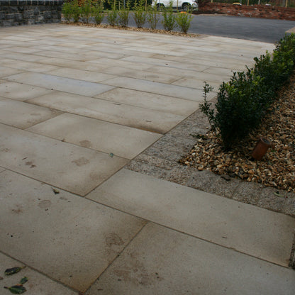 Patio area completed using Mountcharles Sandstone with a Silver Granite cobble border. 
