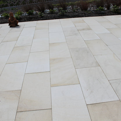 Close up of Mountcharles Sandstone Paving Slabs on a large patio area. 