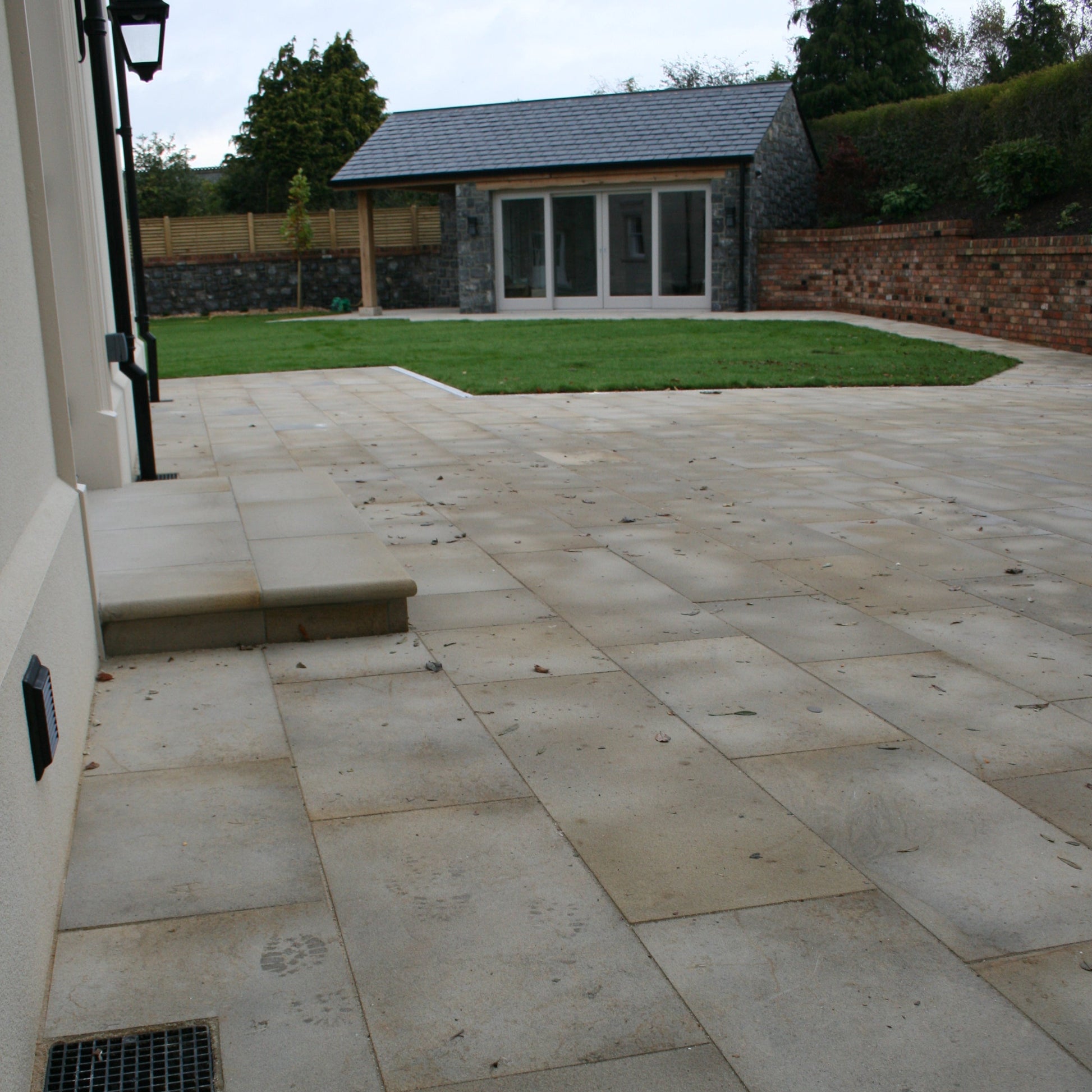 Patio. step and pathway leading to outdoor garden room completed using Mountcharles Sandstone. 