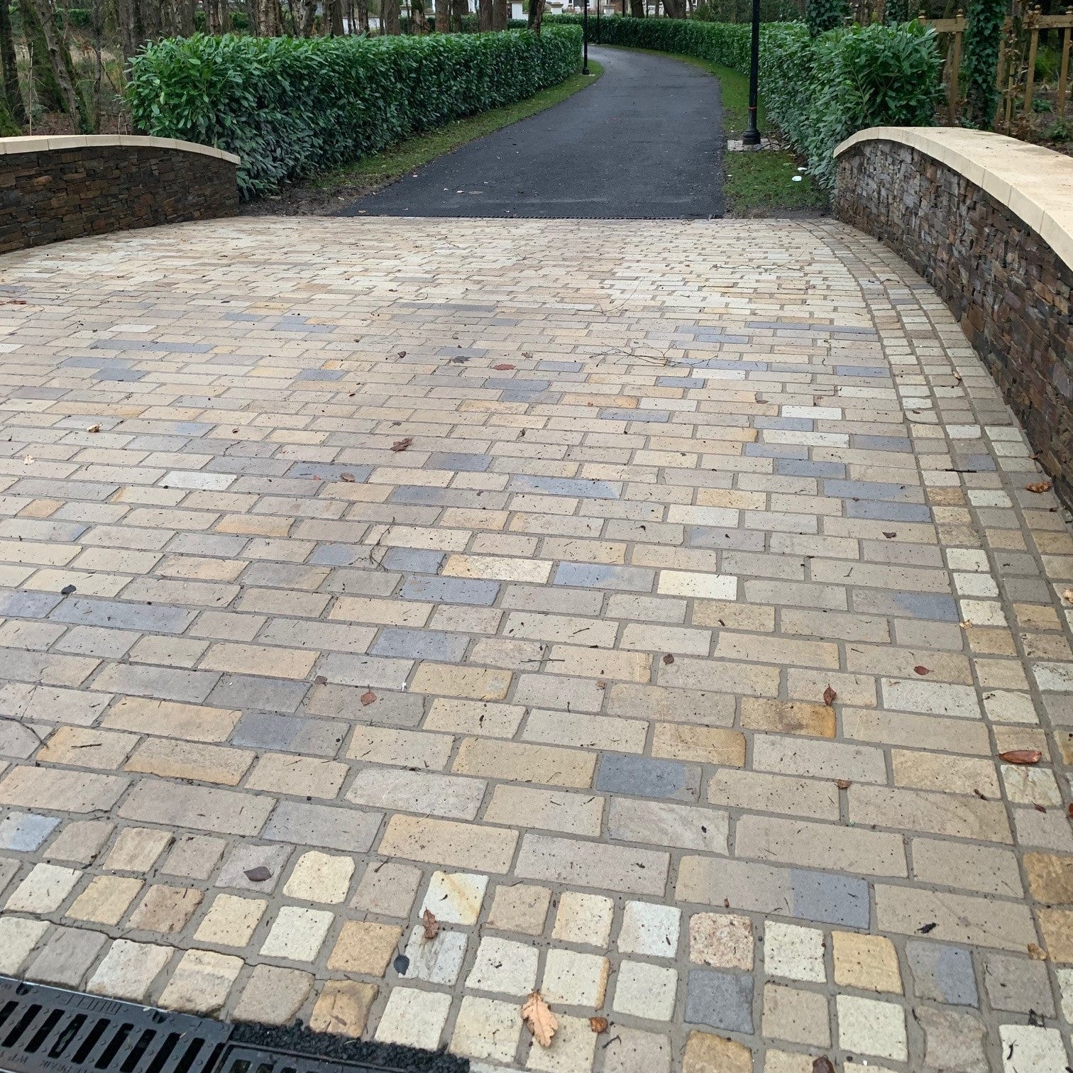 Paved bridge using Mountcharles Sandstone Paving Setts in RL x 100mm and 100 x 100mm Border. 