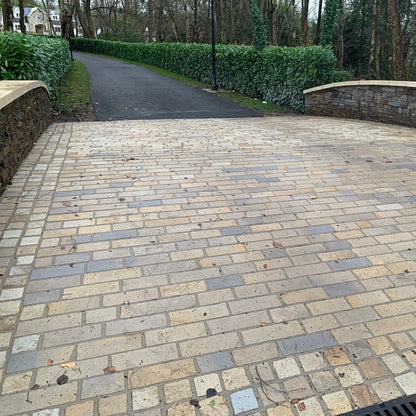Paved bridge using Mountcharles Sandstone Paving Setts in RL x 100mm and 100 x 100mm Border. 