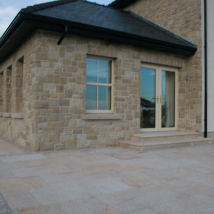 Sunroom cladded in Mountcharles Sandstone Stoneer Cladding. 