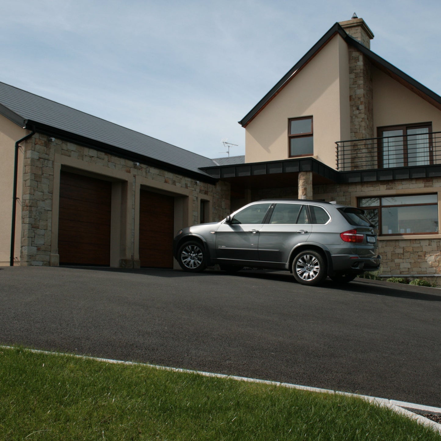 House and garage cladded in Mountcharles Sandstone Stoneer Cladding. 