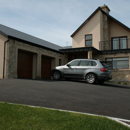 House and garage cladded in Mountcharles Sandstone Stoneer Cladding. 