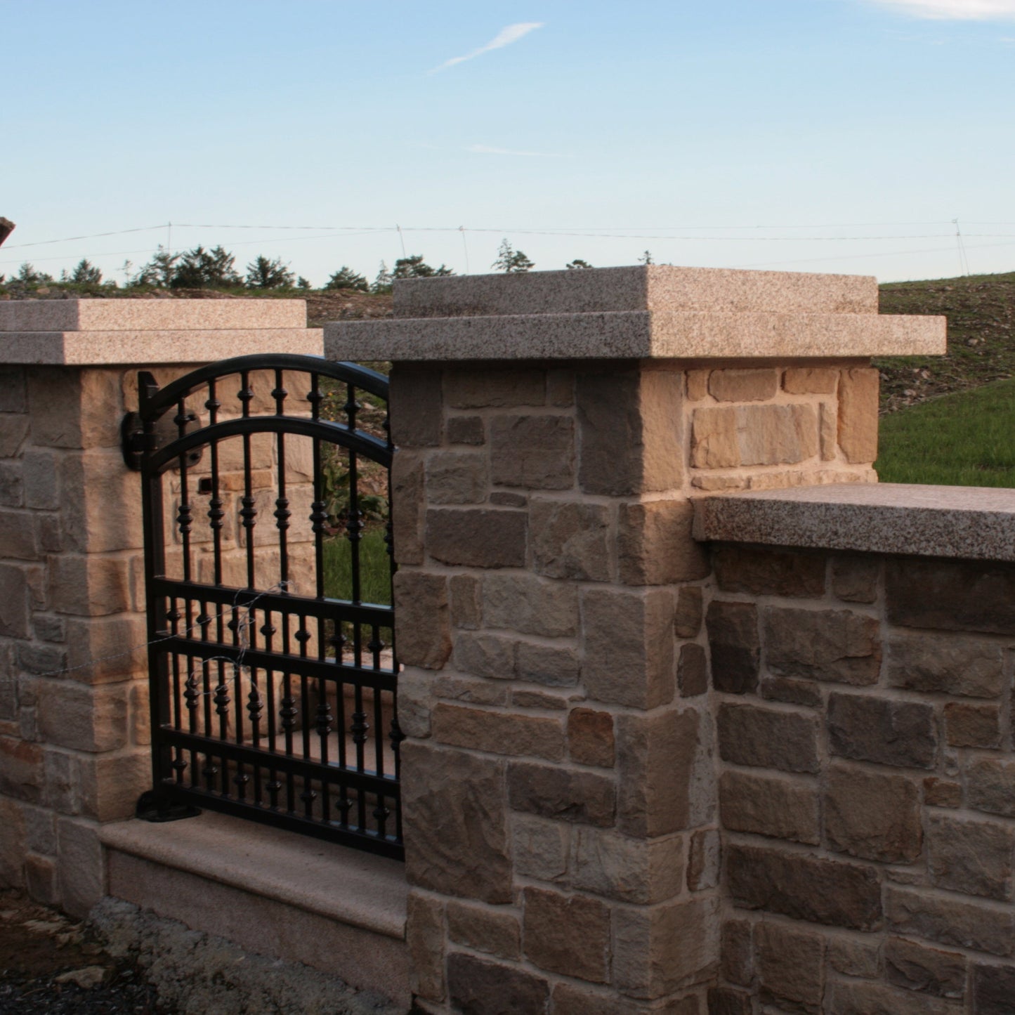 Boundary wall and pillars completed using Mountcharles Sandstone Stoneer Cladding. 