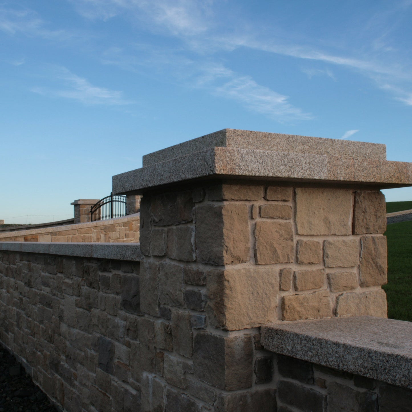 Boundary wall and pillar finished in Mountcharles Sandstone Stoneer Cladding. 